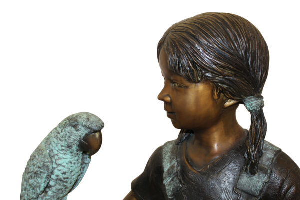 Girl Holding a Parrot Bronze Statue -  Size: 26"L x 19"W x 42"H.