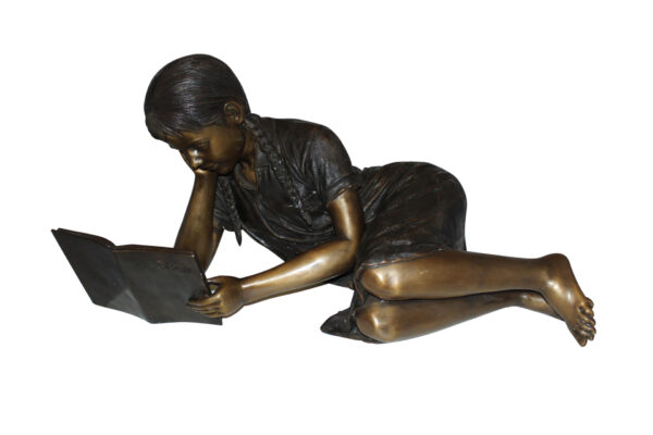 Girl laying reading a book Bronze Statue -  Size: 36"L x 17"W x 18"H.