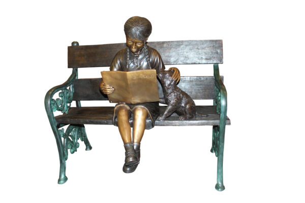 Girl sitting with her dog  on a bench,  reading Bronze Statue - 27" x 39" x 32"H