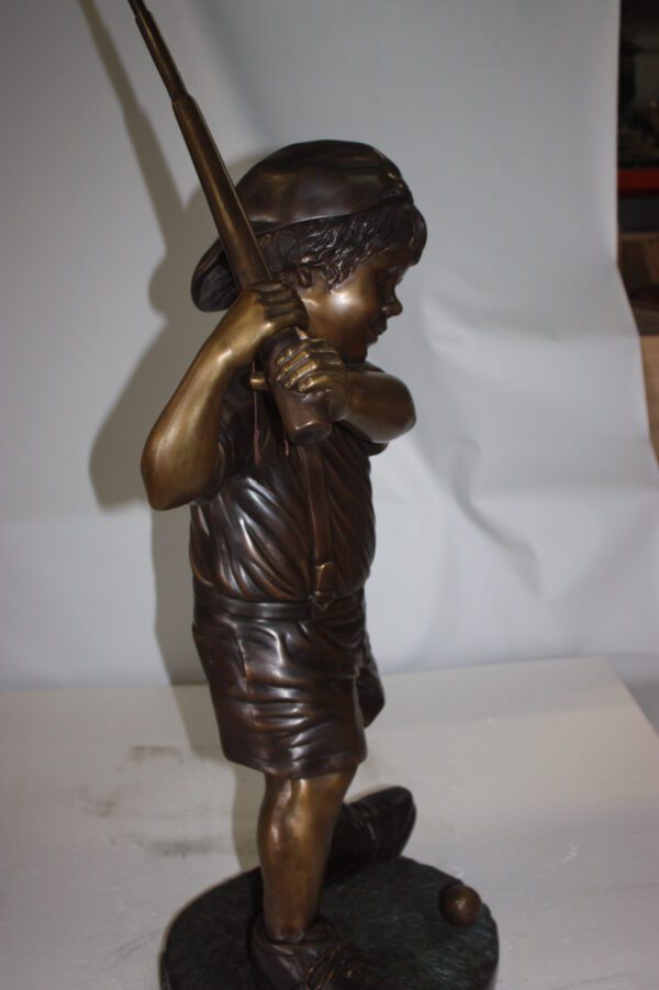 Golfer Boy Bronze - Big shoes -  Size: 18"L x 14"W x 49"H.