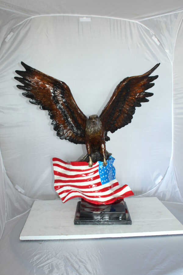 Eagle with American Flag Bronze Statue -  Size: 32"L x 14"W x 35"H.