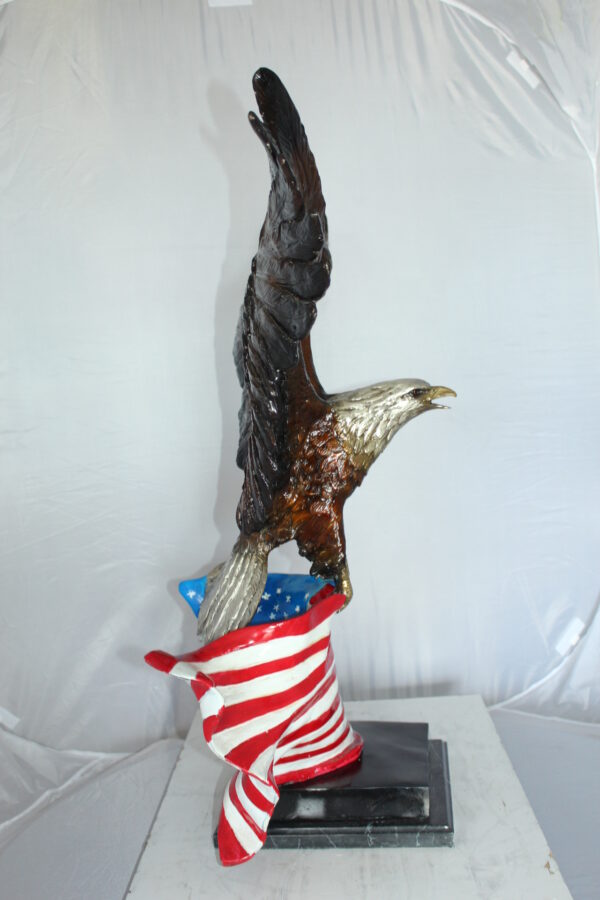 Eagle with American Flag Bronze Statue -  Size: 32"L x 14"W x 35"H.