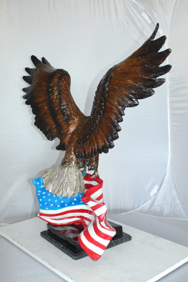 Eagle with American Flag Bronze Statue -  Size: 32"L x 14"W x 35"H.