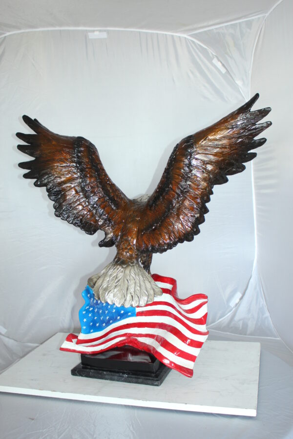 Eagle with American Flag Bronze Statue -  Size: 32"L x 14"W x 35"H.