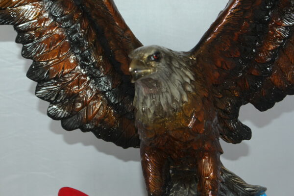 Eagle with American Flag Bronze Statue -  Size: 32"L x 14"W x 35"H.