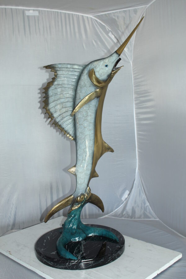 One Sailfish Jumping of the ware - Bronze Statue -  Size: 16"L x 16"W x 39"H.