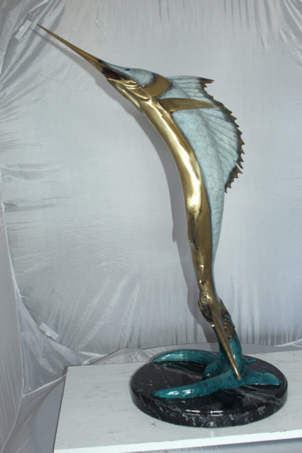 One Sailfish Jumping of the ware - Bronze Statue -  Size: 16"L x 16"W x 39"H.