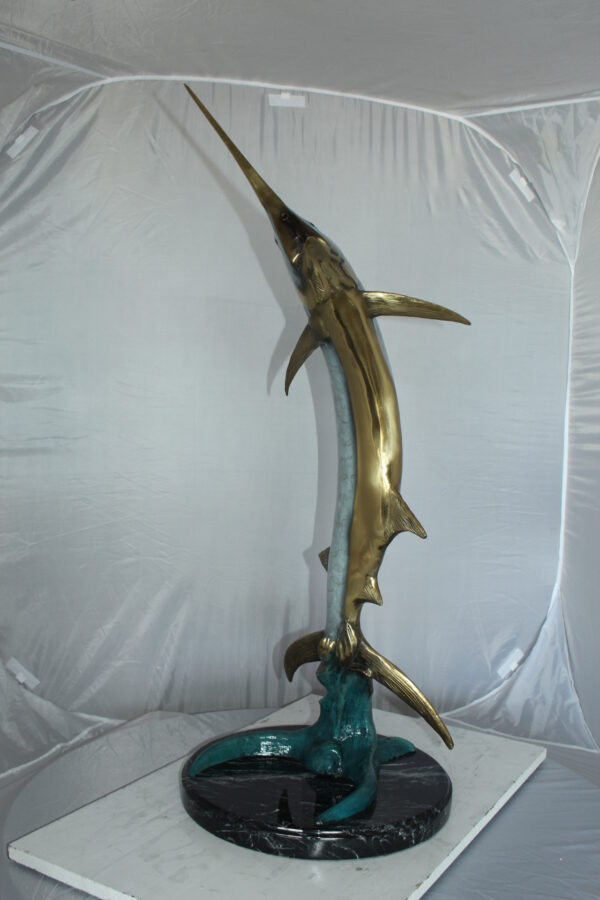 One Sailfish Jumping of the ware - Bronze Statue -  Size: 16"L x 16"W x 39"H.