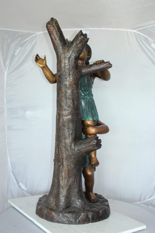 Two Kids Climbing on a Tree Bronze Statue -  Size: 17"L x 17"W x 46"H.