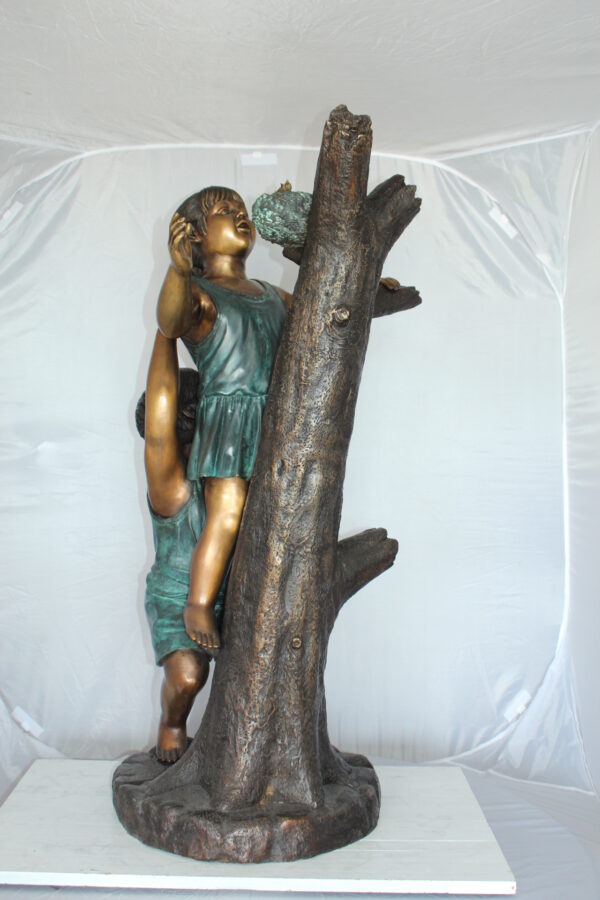 Two Kids Climbing on a Tree Bronze Statue -  Size: 17"L x 17"W x 46"H.