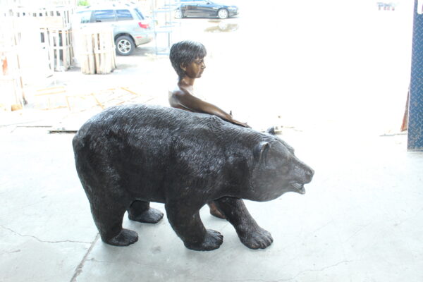 A bear with a boy bronze statue -  Size: 39"L x 24"W x 32"H. - Image 4