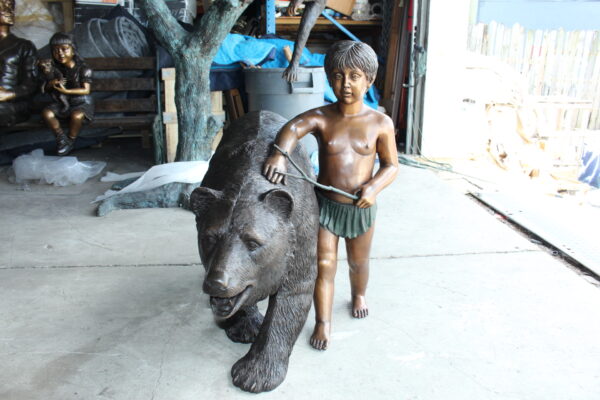 A bear with a boy bronze statue -  Size: 39"L x 24"W x 32"H. - Image 5