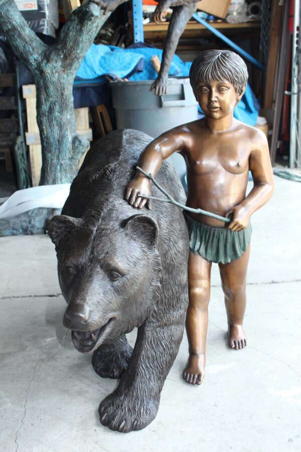 A bear with a boy bronze statue -  Size: 39"L x 24"W x 32"H. - Image 6