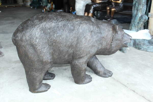 A bear walking Bronze Statue -  Size: 39"L x 12"W x 24"H.