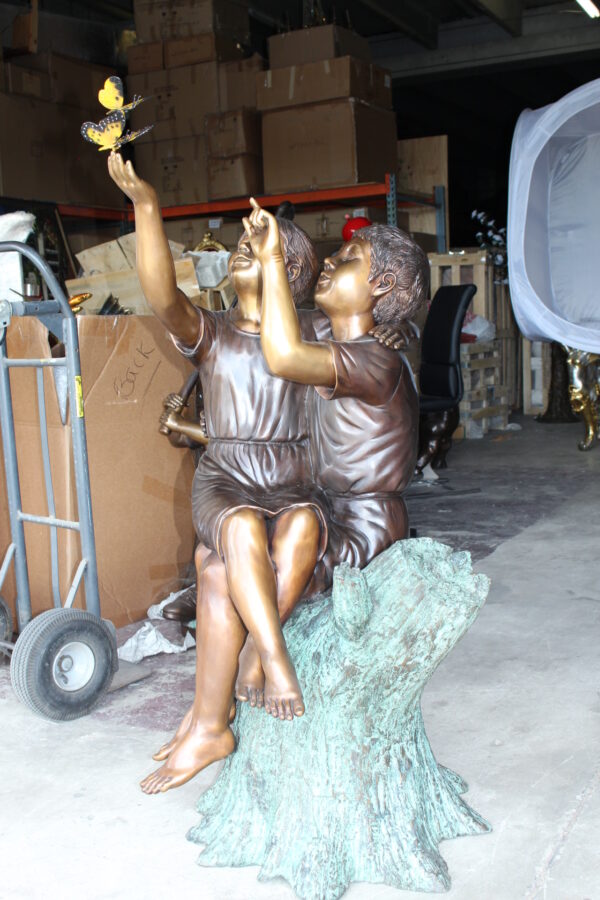 Two Kids Playing with Butterflies Bronze Statue -  Size: 30"L x 30"W x 50"H.