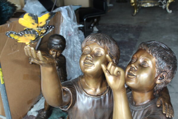 Two Kids Playing with Butterflies Bronze Statue -  Size: 30"L x 30"W x 50"H.