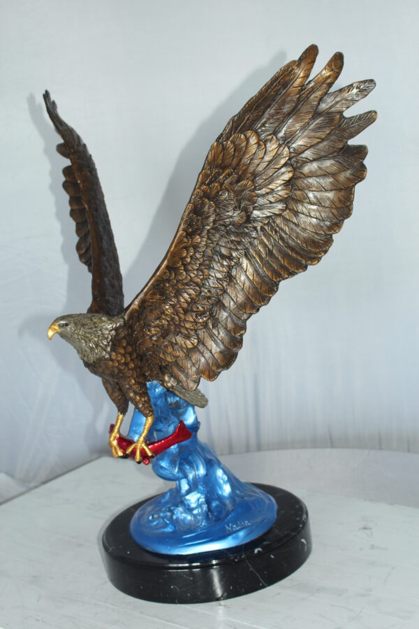 Eagle Catching his Prey Bronze Statue -  Size: 17"L x 20"W x 25"H.