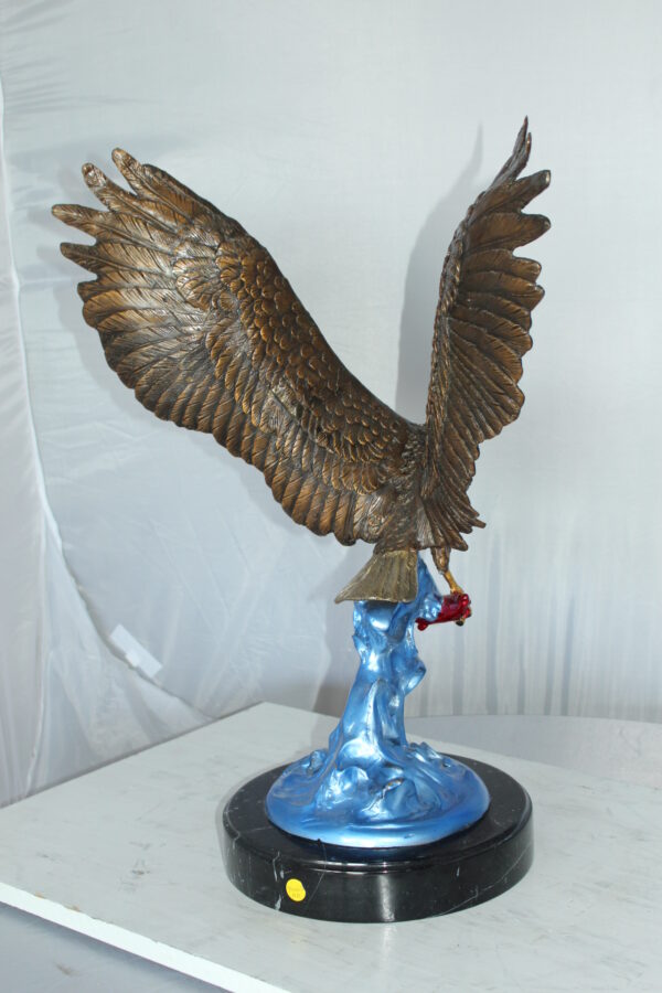 Eagle Catching his Prey Bronze Statue -  Size: 17"L x 20"W x 25"H.