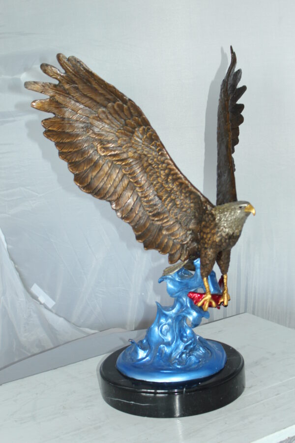 Eagle Catching his Prey Bronze Statue -  Size: 17"L x 20"W x 25"H.