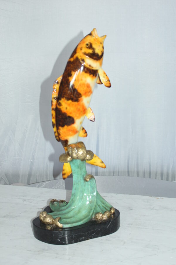 Coy Fish Jumping off the Water Bronze Statue -  Size: 10"L x 9"W x 22"H.