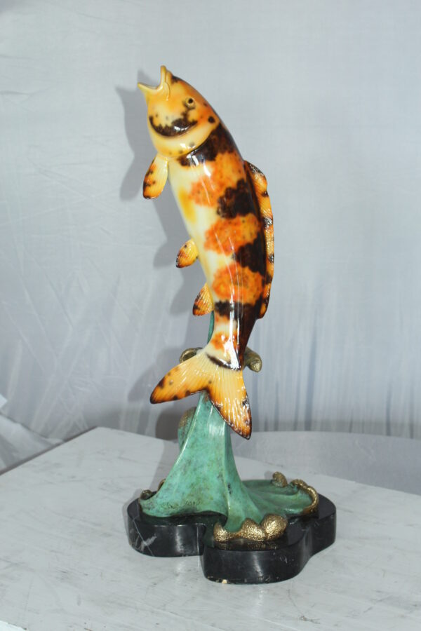 Coy Fish Jumping off the Water Bronze Statue -  Size: 10"L x 9"W x 22"H.