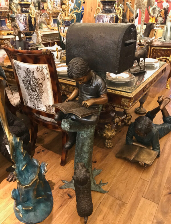 Boy Sitting by a Mailbox reading a book Bronze Statue -  16"L x 20"W x 50"H.