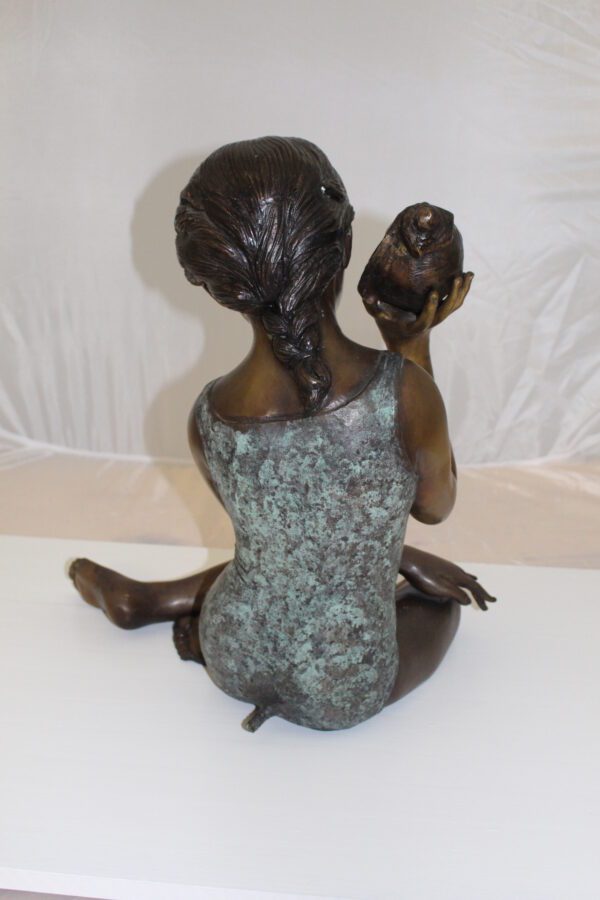 Girl listening to a Shell fountain-Bronze Statue -  Size: 17"L x 10"W x 20"H.