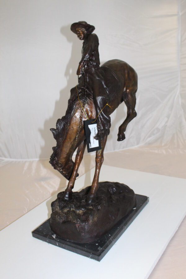 Outlaw Remington Bronze Statue -  Size: 19"L x 10"W x 26"H.