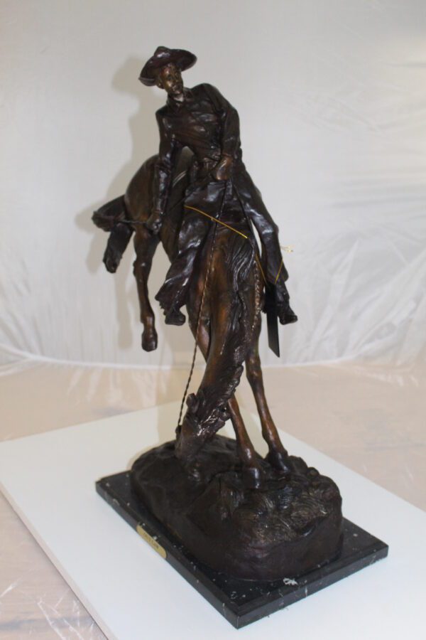 Outlaw Remington Bronze Statue -  Size: 19"L x 10"W x 26"H.