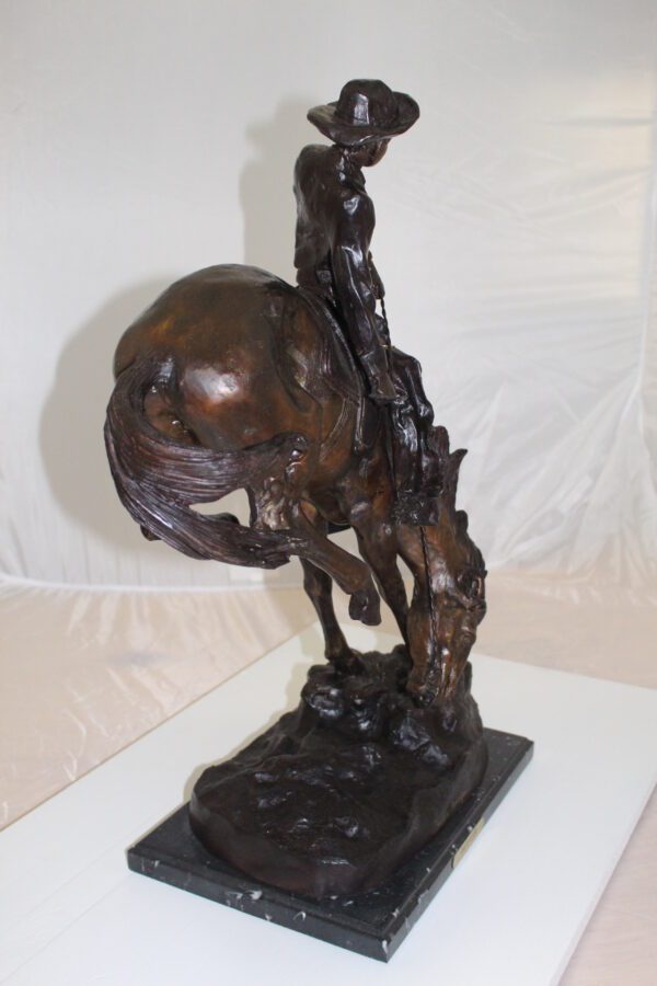 Outlaw Remington Bronze Statue -  Size: 19"L x 10"W x 26"H.