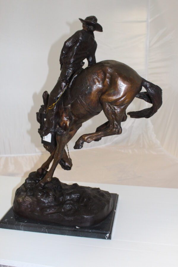 Outlaw Remington Bronze Statue -  Size: 19"L x 10"W x 26"H.