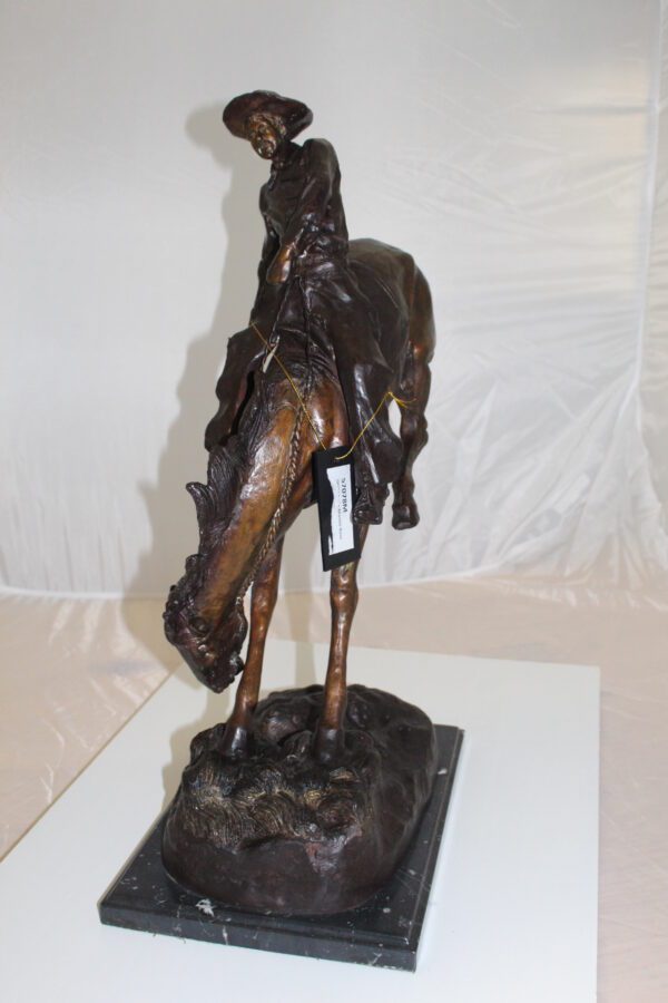 Outlaw Remington Bronze Statue -  Size: 19"L x 10"W x 26"H.