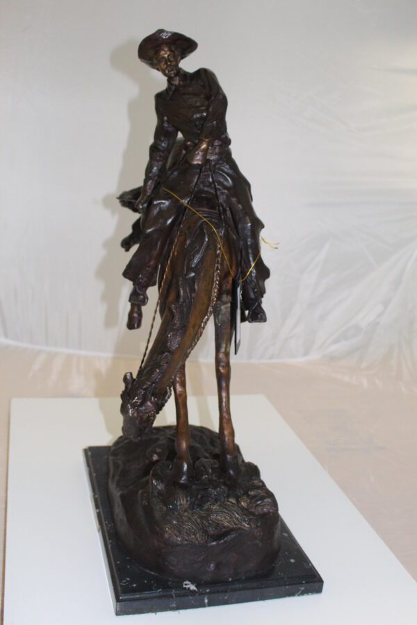 Outlaw Remington Bronze Statue -  Size: 19"L x 10"W x 26"H.