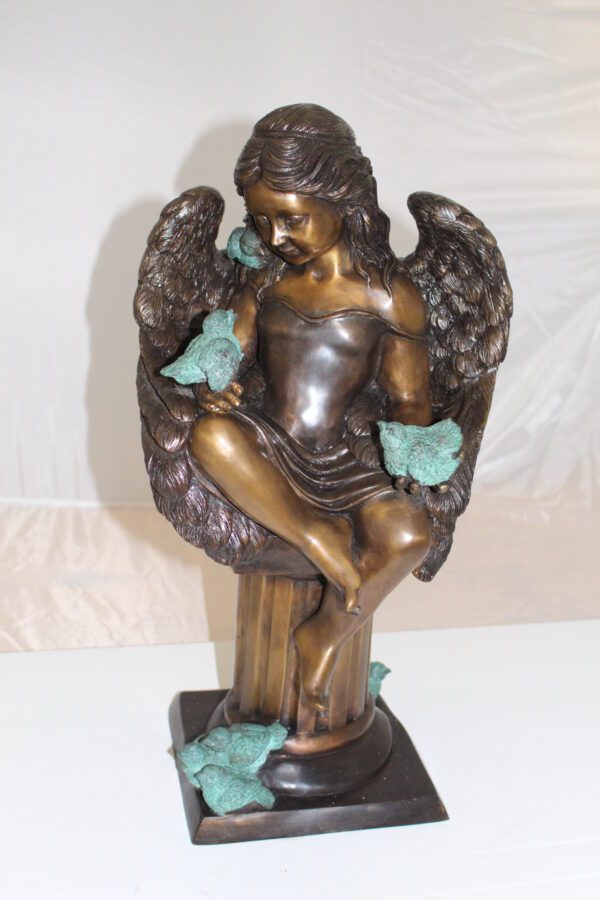 Angel sitting on Column Bronze Statue -  Size: 10"L x 9"W x 22"H.