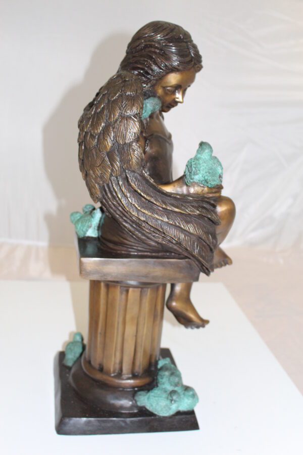 Angel sitting on Column Bronze Statue -  Size: 10"L x 9"W x 22"H.