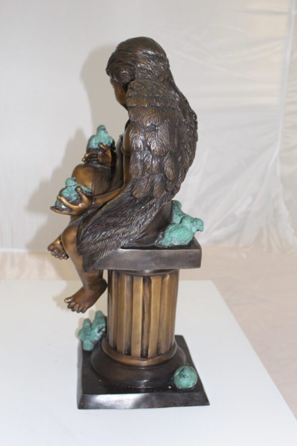 Angel sitting on Column Bronze Statue -  Size: 10"L x 9"W x 22"H.