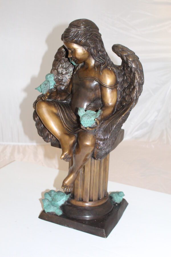 Angel sitting on Column Bronze Statue -  Size: 10"L x 9"W x 22"H.