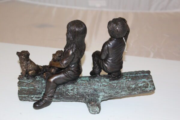 Two kids with dog on log Bronze Statue -  Size: 12"L x 5"W x 8.5"H.