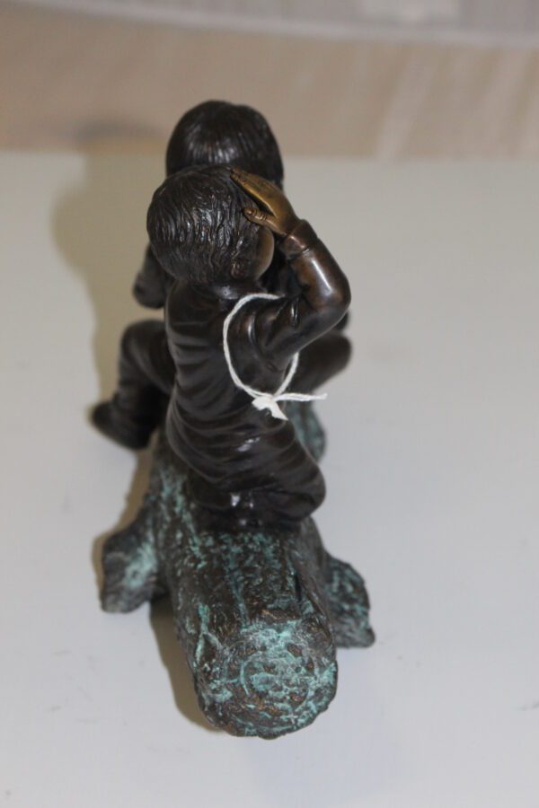 Two kids with dog on log Bronze Statue -  Size: 12"L x 5"W x 8.5"H.