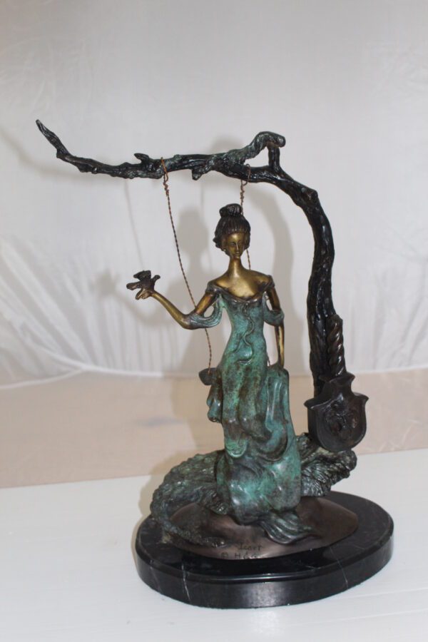 Girl on a swing Bronze Statue -  Size: 15"L x 8"W x 21"H.