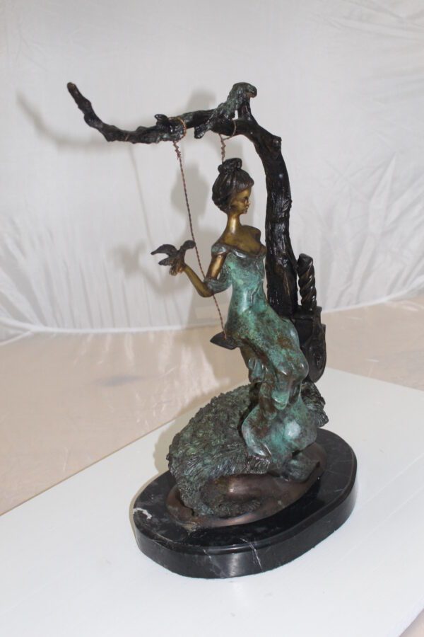 Girl on a swing Bronze Statue -  Size: 15"L x 8"W x 21"H.