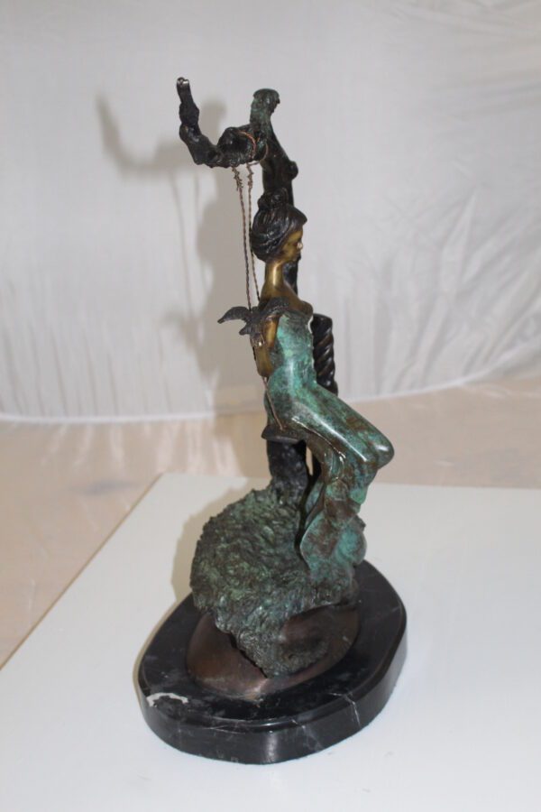 Girl on a swing Bronze Statue -  Size: 15"L x 8"W x 21"H.