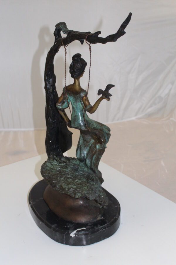 Girl on a swing Bronze Statue -  Size: 15"L x 8"W x 21"H.