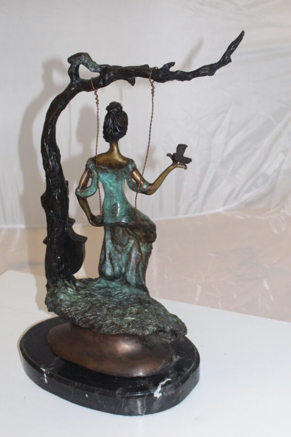 Girl on a swing Bronze Statue -  Size: 15"L x 8"W x 21"H.