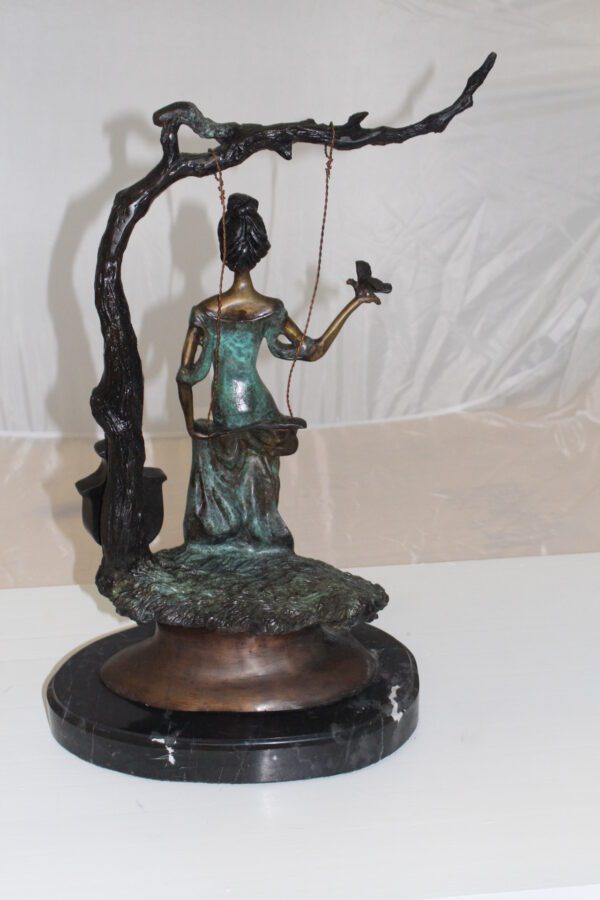 Girl on a swing Bronze Statue -  Size: 15"L x 8"W x 21"H.