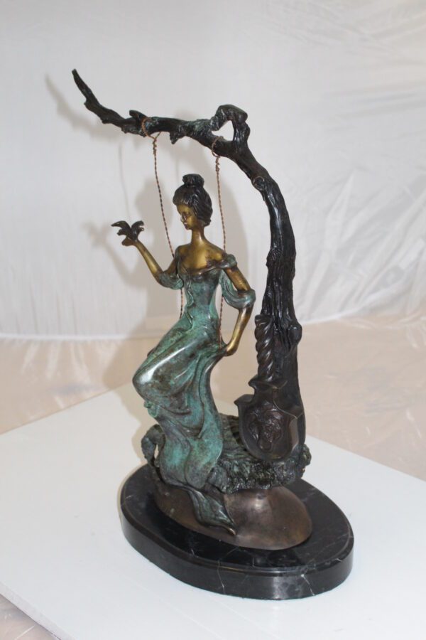 Girl on a swing Bronze Statue -  Size: 15"L x 8"W x 21"H.