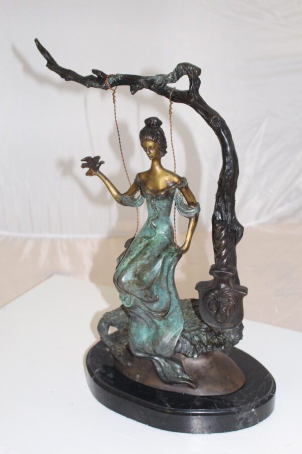 Girl on a swing Bronze Statue -  Size: 15"L x 8"W x 21"H.