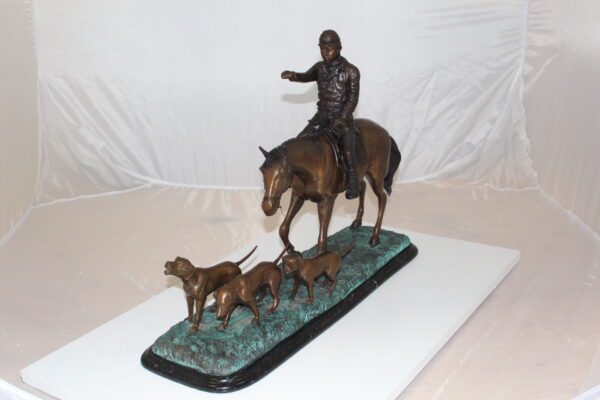 Hunter with 3 dogs Bronze Statue -  Size: 26"L x 8"W x 19"H.