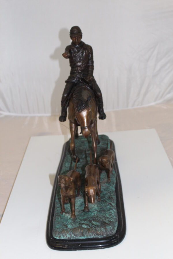 Hunter with 3 dogs Bronze Statue -  Size: 26"L x 8"W x 19"H.