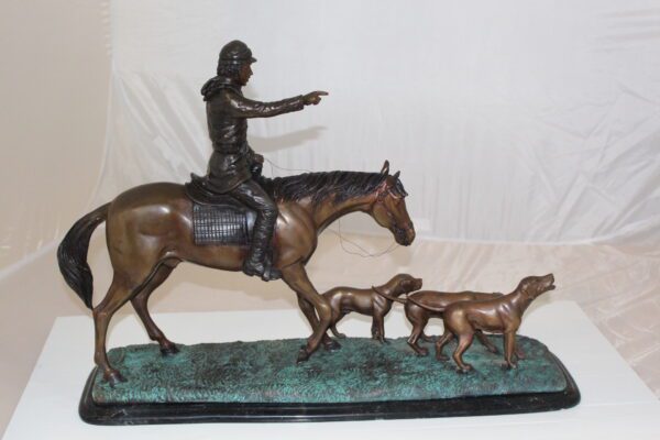 Hunter with 3 dogs Bronze Statue -  Size: 26"L x 8"W x 19"H.